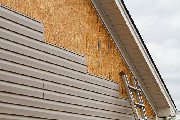 Professional Siding Installation technician working in Louisville, IL